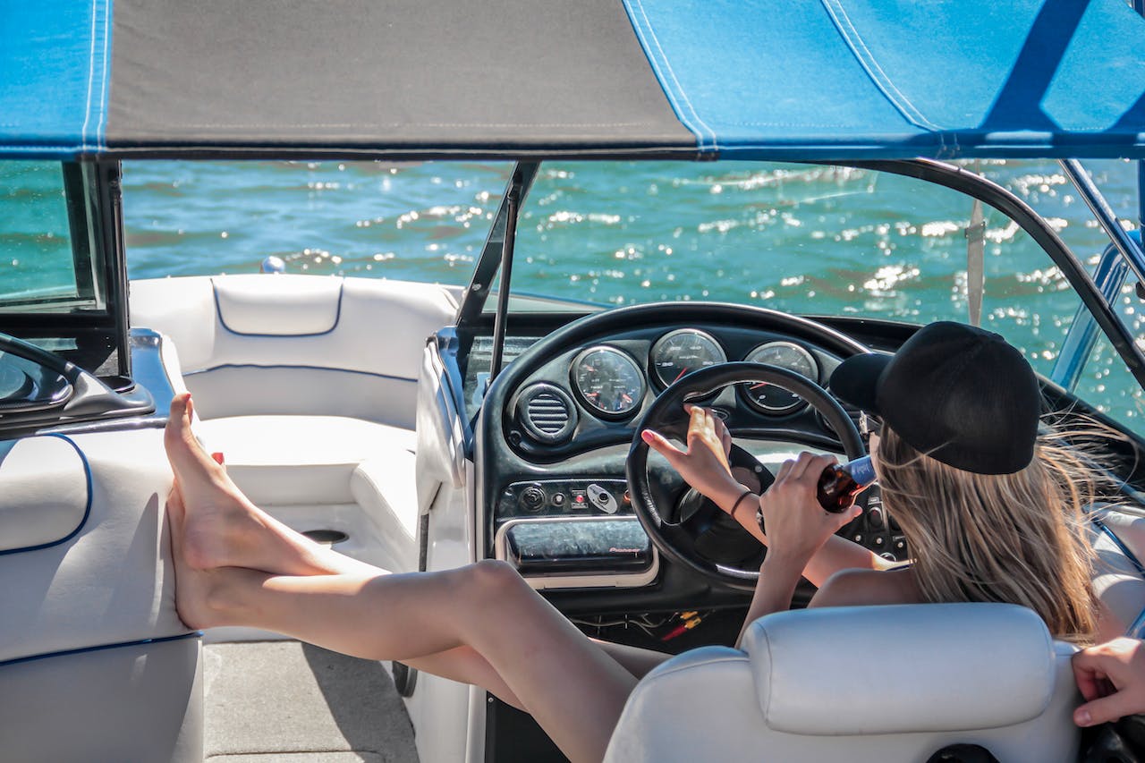 woman relaxing on a boat drinking a beverage